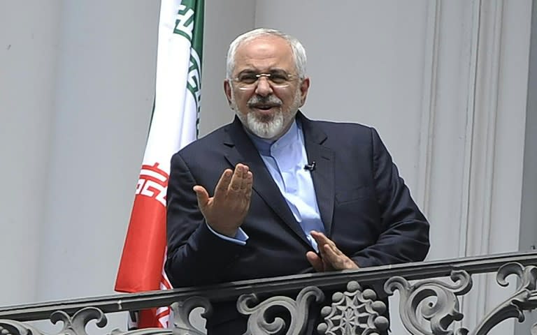 Iranian Foreign Minister Javad Zarif talks to media from the balcony of the Palais Coburg Hotel in Vienna, on July 2, 2015