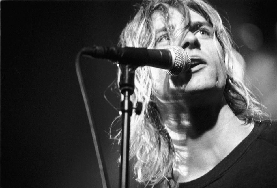 <p>A close up shot of Kurt Cobain's signature grunge hairstyle, which inspired many during the early '90s, during a performance in Amsterdam in 1991. </p>