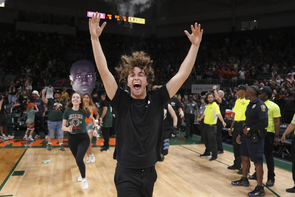 Miami (Fl) Hurricanes students storm the court after the team defeated the Pittsburgh Panthers 78-76 to win a share of the ACC regular season Championship at Watsco Center on March 4, 2023 in Coral Gables, Florida. Eric Espada/Getty Images