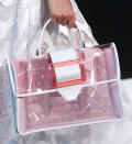 <p>Edgy transparent bags were a hit at Armani. <em>[Photo: Rex]</em> </p>