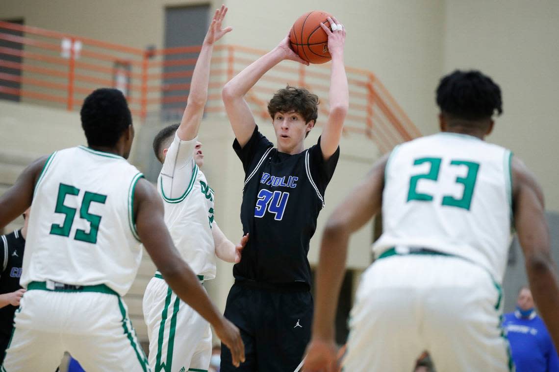 Lexington Catholic’s Reece Potter looks to pass the ball in a game against Paul Laurence Dunbar during the 2020-21 season.