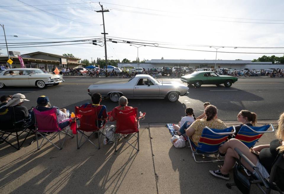 Classic car owners cruise down McHenry Avenue during the Graffiti Parade in Modesto, Calif., Friday, June 9, 2023. Andy Alfaro/aalfaro@modbee.com