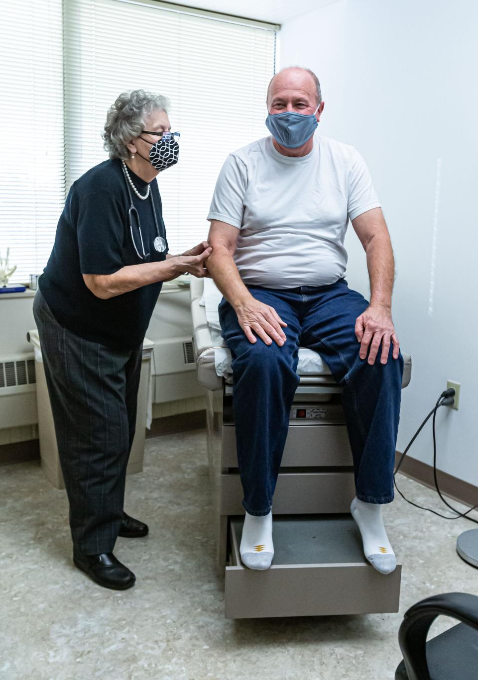 Dr. Barbara Hummel examines patient Dale Torres at her office in Greenfield, Wis. She has been serving patients in the Milwaukee area since 1995, but her practice has seen a dramatic decline in business.