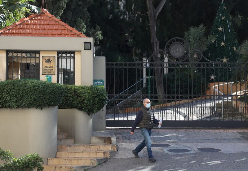 A man walks near the entrance of the Lebanese American University (LAU) in Beirut