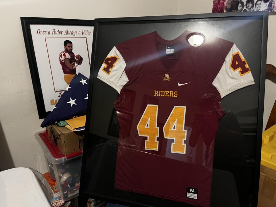 Santos Rivera's jersey, framed inside his aunt Andrea Fernandez's house in East Los Angeles.