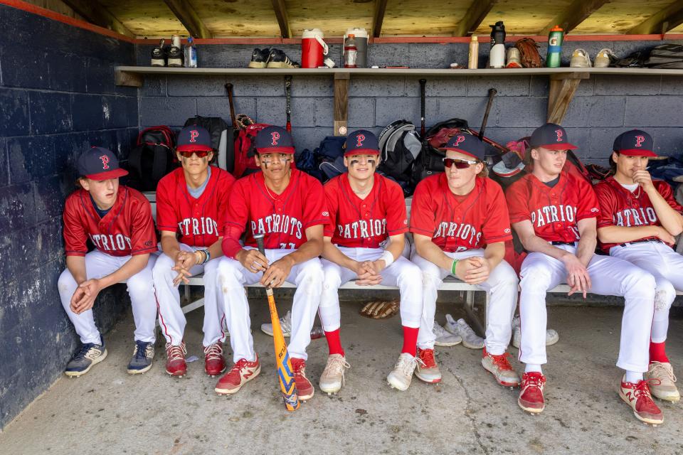 Portsmouth's seniors gather in the dugout for a final regular season home game on Monday.