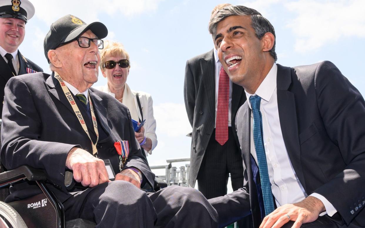 Rishi Sunak speaks with a D-Day veteran