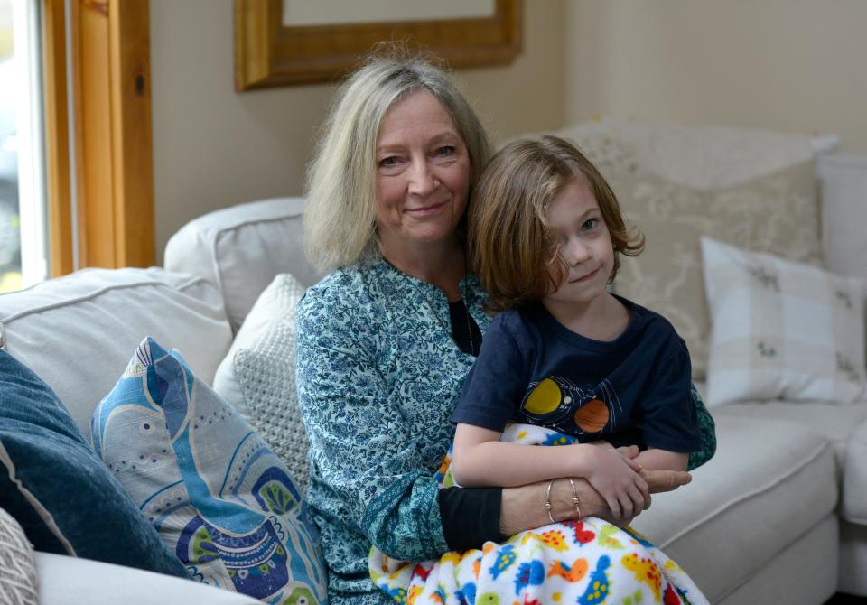 Diane Turco, director of Cape Downwinders, was photographed May 4 at home with her grandchild, Brady Turco, 5. Merrily Cassidy/Cape Cod Times