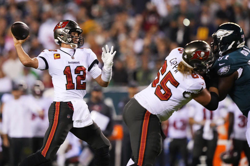 Tampa Bay Buccaneers quarterback Tom Brady (12) looks to pass during the first half of an NFL football game against the Philadelphia Eagles on Thursday, Oct. 14, 2021, in Philadelphia. (AP Photo/Matt Slocum)