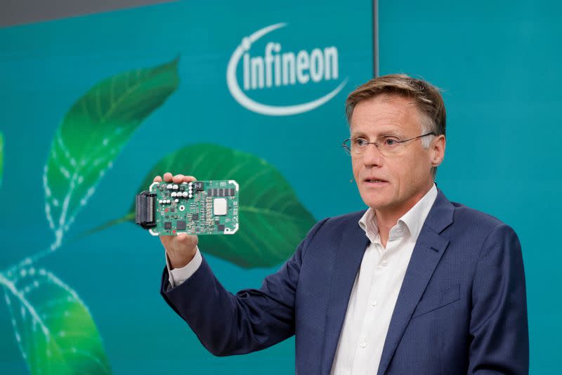 FILE PHOTO: Infineon CEO Hanebeck holds up Infineon Aurix-Microcontroller during the annual results news conference in Munich