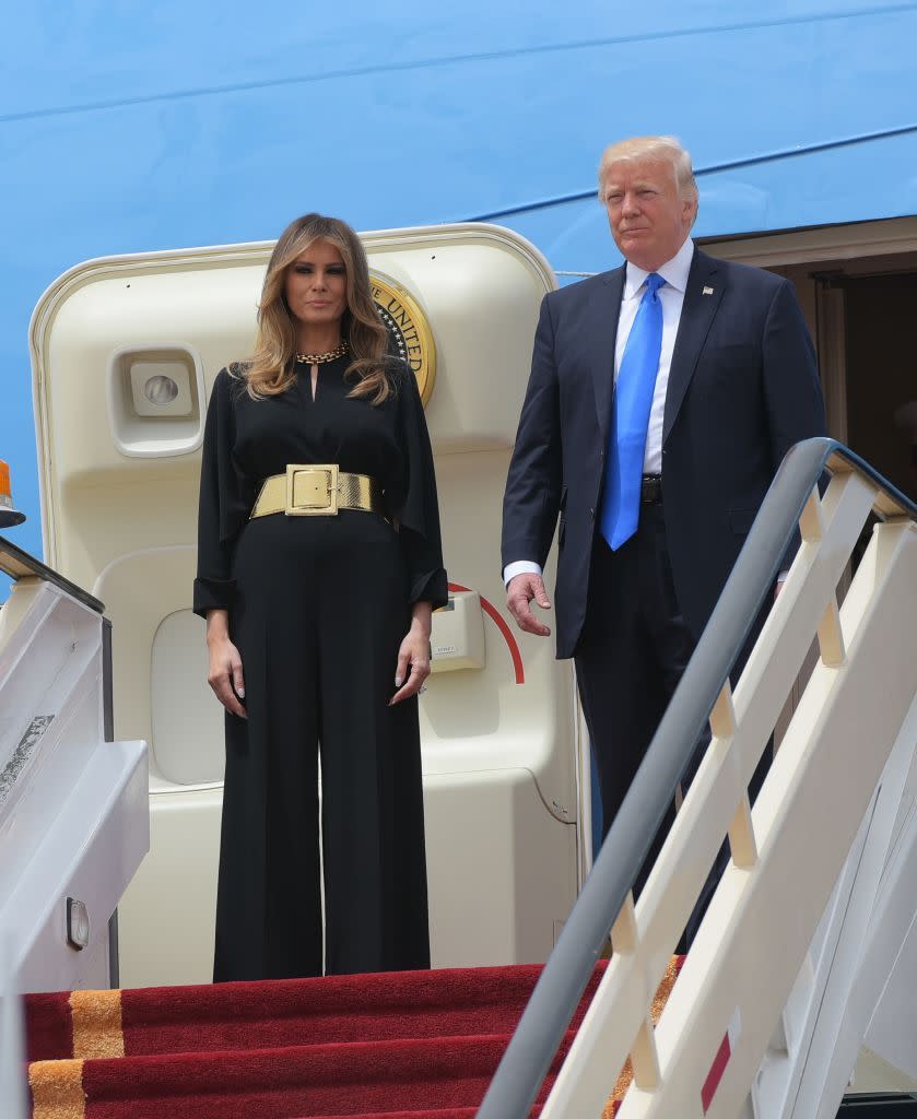 <p>On the first stop of their tour, the President and First Lady landed in Saudi Arabia. She wore a Stella McCartney jumpsuit tailored with a gold high-waist belt by Ralph Lauren. The outfit did not include a headscarf, which caused a stir <a href="https://www.townandcountrymag.com/society/politics/a9900221/melania-trump-saudi-arabia/" rel="nofollow noopener" target="_blank" data-ylk="slk:due to the President's previous comments" class="link ">due to the President's previous comments</a>. </p>
