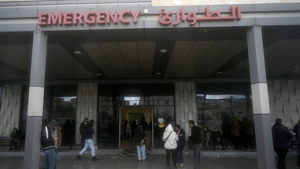 PHOTO: Journalists gather outside of Ibn Sina Hospital following a deadly Israeli military raid in the West Bank town of Jenin, Jan. 30, 2024.  (Majdi Mohammed/AP)