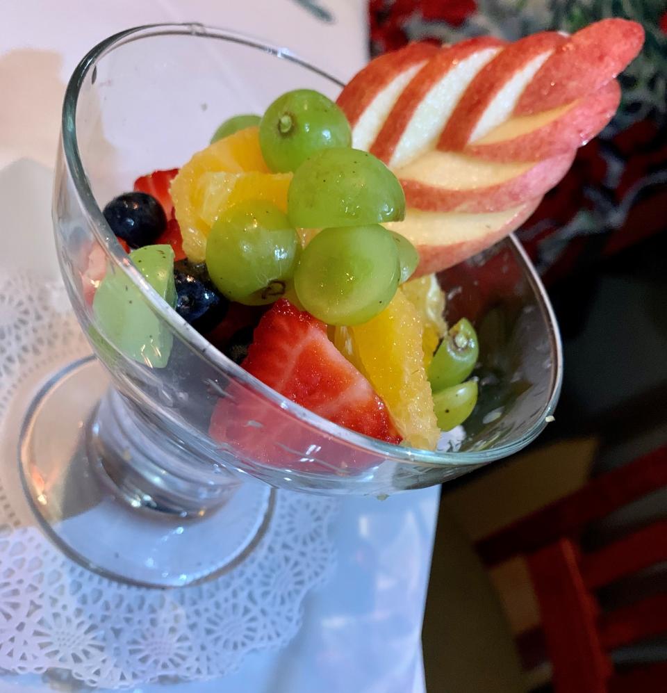 The fruit cup at Heidi's Jazz Club & Restaurant in Cocoa Beach came in a cocktail-style glass with a carved apple at its back.