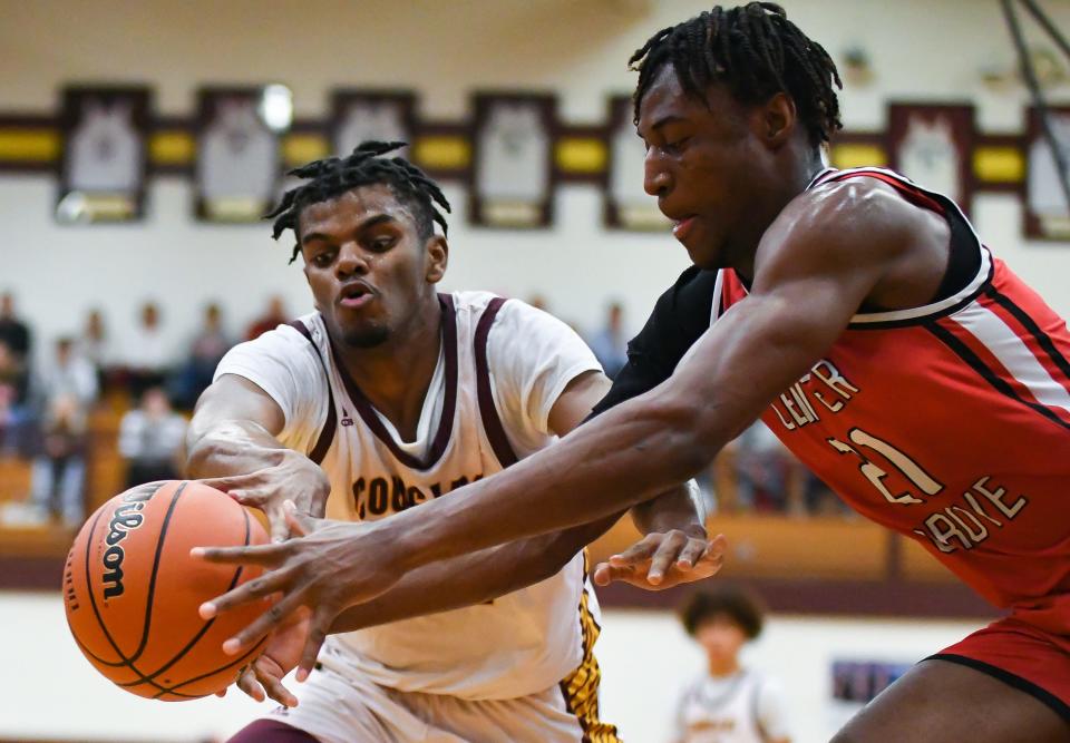 Bloomington North’s Nehemiah Dangerfield and Center Grove’s Michael Ephraim (21) chase after a loose ball during the IHSAA boys’ basketball sectional semifinal game at Bloomington North on Friday, March 1, 2024.