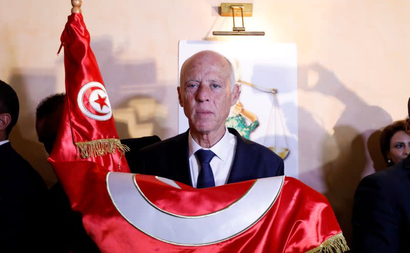 FILE PHOTO: Tunisian presidential candidate Kais Saied reacts after exit poll results were announced in a second round runoff of the presidential election in Tunis