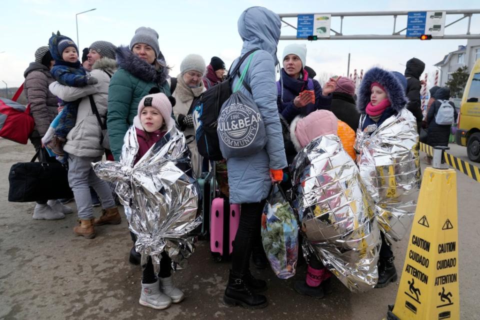 Refugees who fled neighbouring Ukraine at the border crossing in Palanca, Moldova (Sergei Grits/AP) (AP)