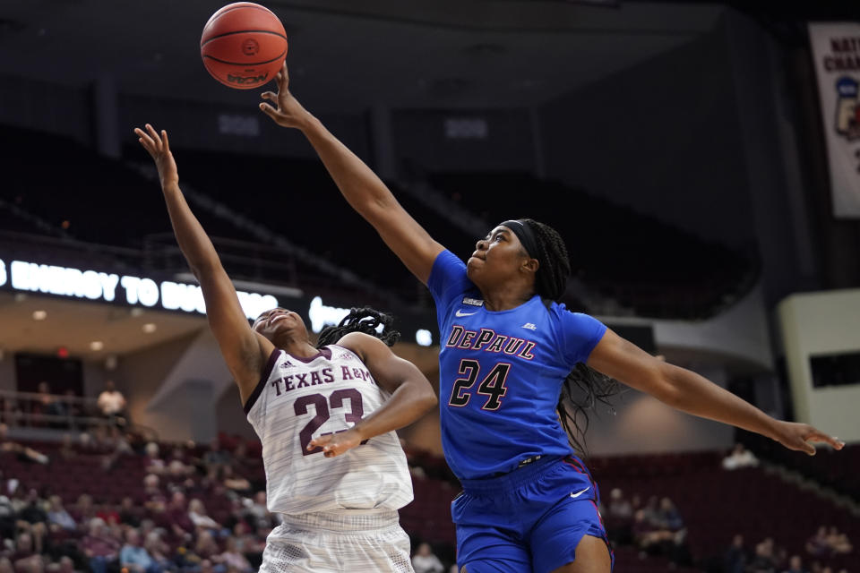 FILE - DePaul forward Aneesah Morrow (24) blocks a shot by Texas A&M guard McKinzie Green (23) during the first half of an NCAA college basketball game Monday, Nov. 15, 2021, in College Station, Texas. Morrow was named to the women's Associated Press preseason All-America team, Tuesday, Oct. 25, 2022. (AP Photo/Sam Craft, File)