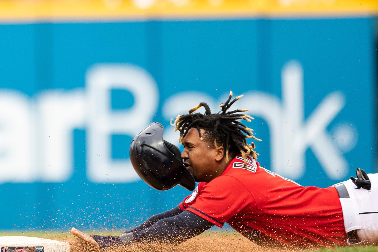 Oct. 2: The Cleveland Guardians' José Ramírez loses his helmet as he slides stealing second base during the seventh inning at Progressive Field. The Guardians won the game, 7-5.