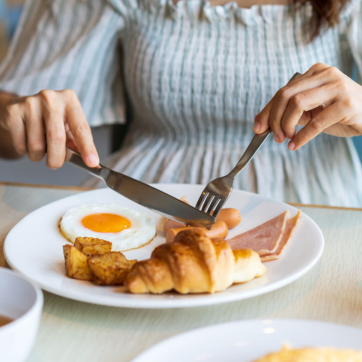 woman eating breakfast