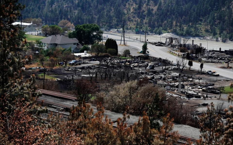 Damaged structures are seen in Lytton, British Columbia, after a wildfire destroyed most of the village - AP