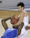 Wisconsin forward Duje Dukan, top, fights for a loose ball with Kentucky forward Alex Poythress during the first half of an NCAA Final Four tournament college basketball semifinal game Saturday, April 5, 2014, in Arlington, Texas. (AP Photo/Tony Gutierrez)