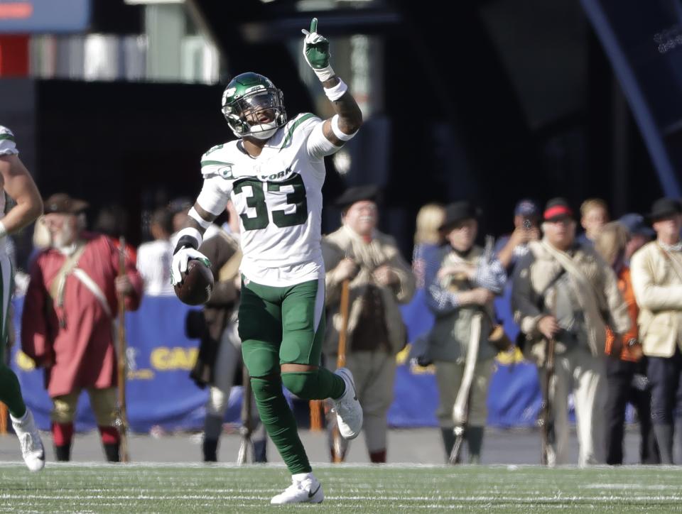 New York Jets safety Jamal Adams celebrates after he intercepted a pass for a touchdown in the second half of an NFL football game against the New England Patriots, Sunday, Sept. 22, 2019, in Foxborough, Mass. (AP Photo/Steven Senne)