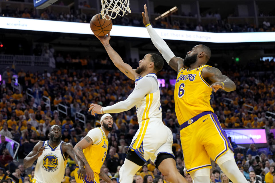 Stephen Curry of the Golden State Warriors drives to the basket against LeBron James of the Los Angeles Lakers during the third quarter in Game 5 of the Western Conference semifinal series at Chase Center in San Francisco on May 10, 2023. (Photo by Thearon W. Henderson/Getty Images)