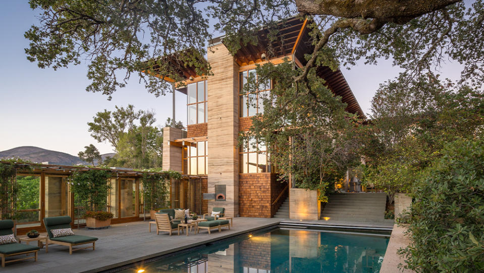 The pool contrasts with the home’s contemporary design.