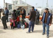 Syrians evacuated from the rebel-held Eastern Ghouta town of Harasta arrive at a camp for displaced people at Maaret al-Ikhwan in rebel-held territory in the northwest on March 23, 2018