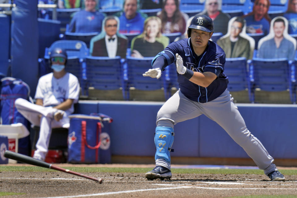 Tampa Bay Rays' Ji-Man Choi loses his bat after taking a wild swing on a pitch by Toronto Blue Jays' Trent Thornton during the first inning of a baseball game Monday, May 24, 2021, in Dunedin, Fla. (AP Photo/Chris O'Meara)