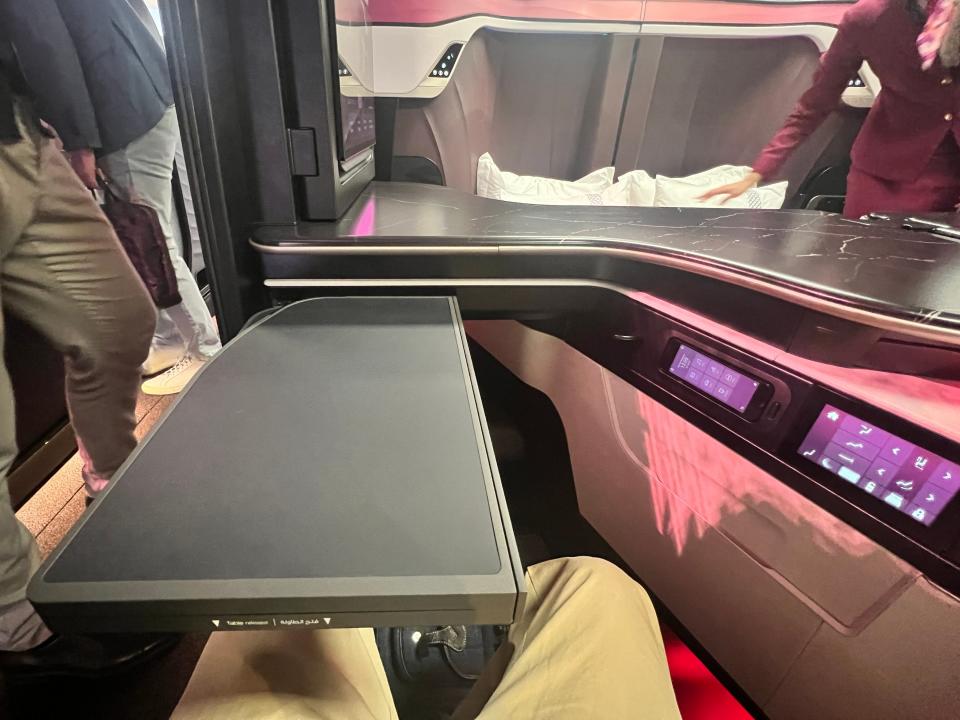 A first-person view of the bi-fold dining table on the QSuite Next Gen at Farnborough Airshow 2024.