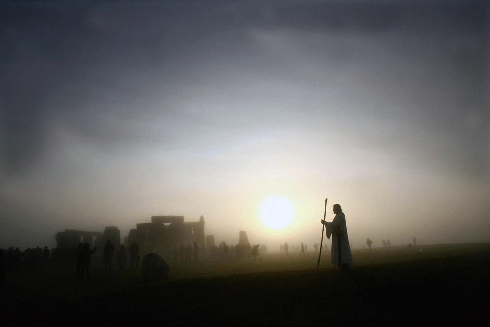 Arthur Pendragon watching the sunrise at Stonehenge in 2005