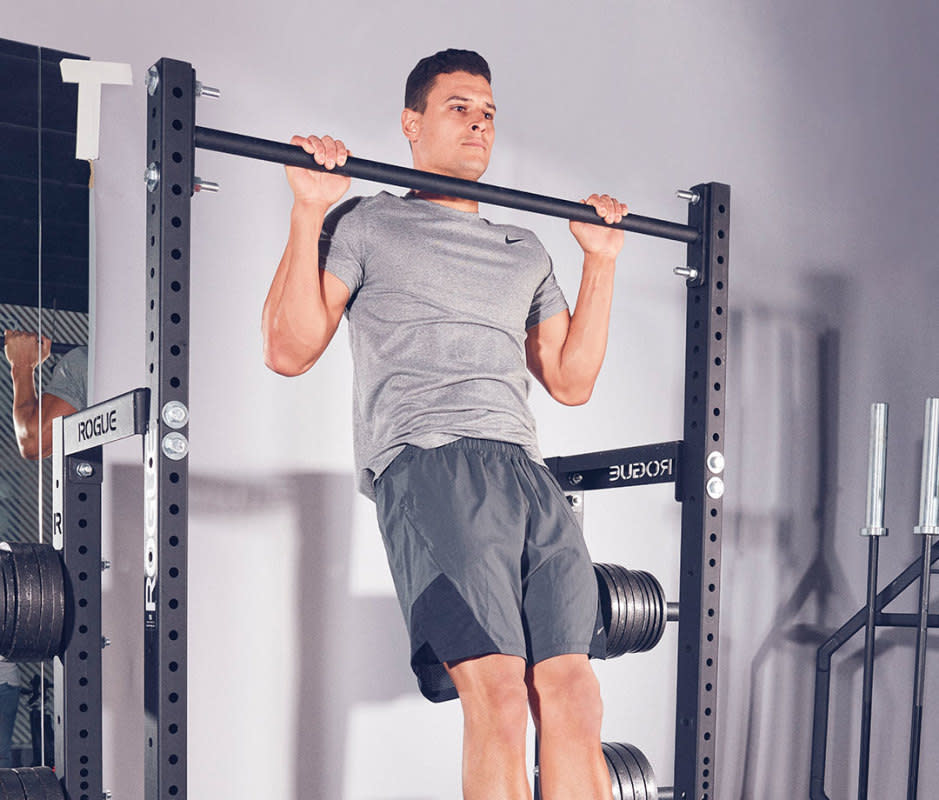 How to do it:<ul><li>Grab the bar with an overhand grip. Hanging from the bar, pull your shoulder blades back and down to lift your body and build momentum.</li><li>Finish by pulling up with your arms.</li></ul>