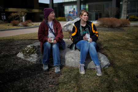 Twenty-one-year-old Syliva Holleran (L) and nineteen-year-old Lauren Duvall, speak to Reuters in Manchester, New Hampshire, U.S., March 28, 2018. REUTERS/Brian Snyder
