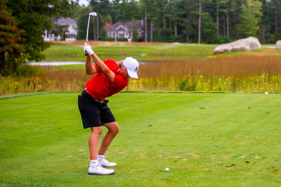 Old Rochester's Luke Pierre uses an iron to attack the green on Hole 9 at the Bay Club.