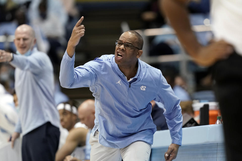 North Carolina head coach Hubert Davis directs his team during the second half of an NCAA college basketball game against Loyola Maryland in Chapel Hill, N.C., Tuesday, Nov. 9, 2021. (AP Photo/Gerry Broome)