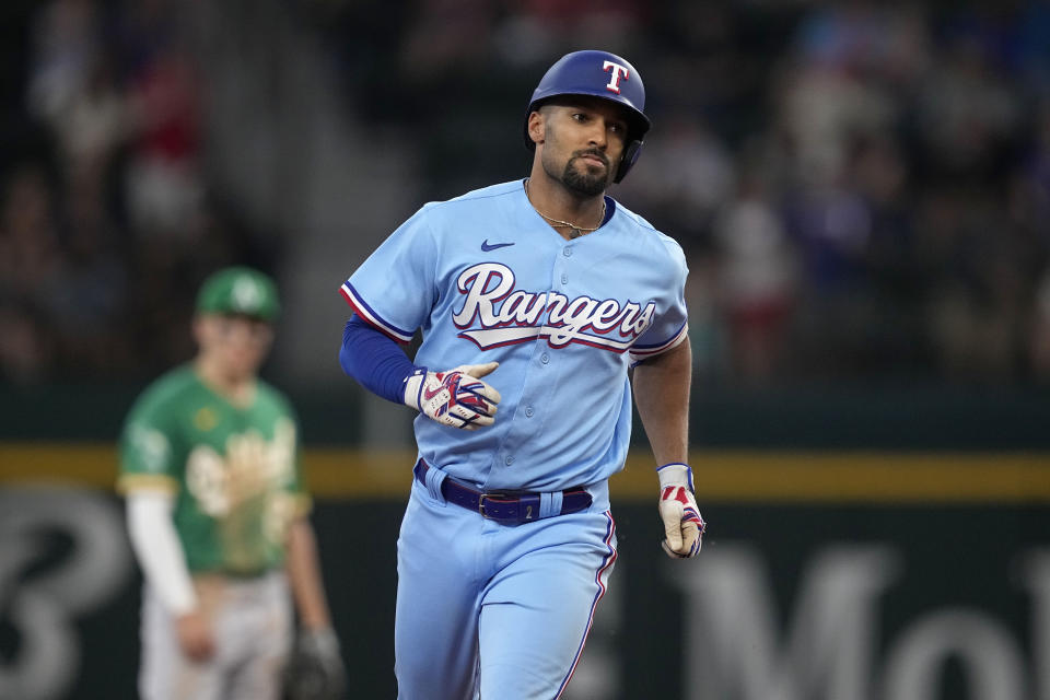 Texas Rangers' Marcus Semien rounds the bases after hitting a solo home run in the sixth inning of a baseball game against the Oakland Athletics, Sunday, Sept. 10, 2023, in Arlington, Texas. (AP Photo/Tony Gutierrez)