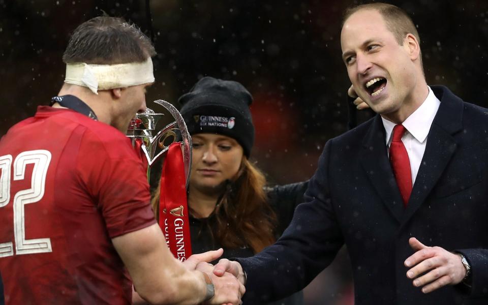 Prince William (right) with Wales' Dan Biggar during the presentation of the Six Nations Trophy after the Guinness Six Nations match at the Principality Stadium, Cardiff. PRESS ASSOCIATION Photo. Picture date: Saturday March 16, 2019. See PA story RUGBYU Wales. Photo credit should read: David Davies/PA Wire. RESTRICTIONS: Editorial use only, No commercial use without prior permission - David Davies/PA Wire