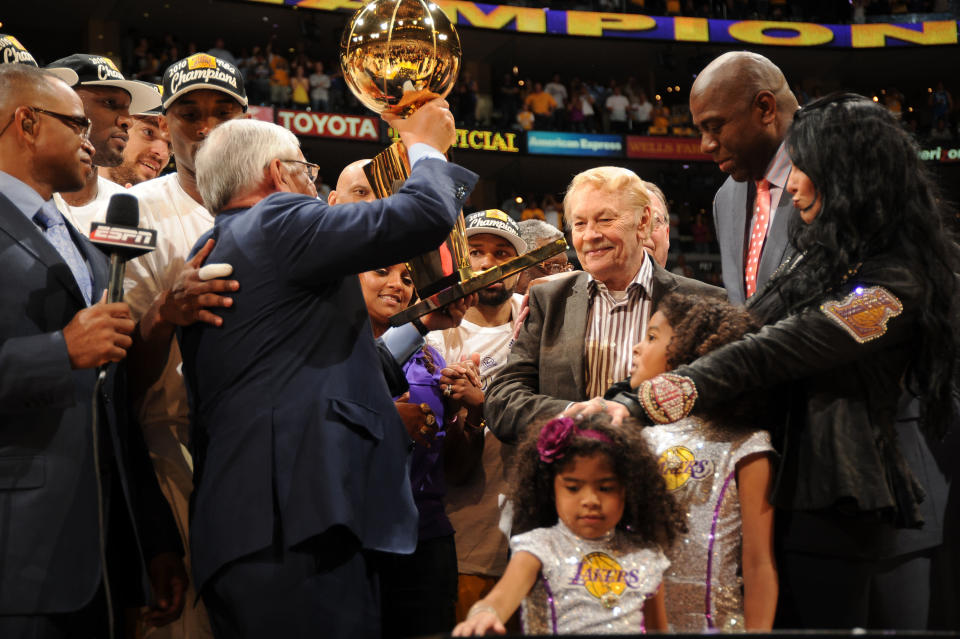 Los Angeles Lakers owner Dr. Jerry Buss receives the Larry O'Brien trophy after his team's victory over the Boston Celtics in Game Seven of the 2010 NBA Finals on June 17, 2010 at Staples Center in Los Angeles, California. (Photo by Andrew D. Bernstein/NBAE via Getty Images)