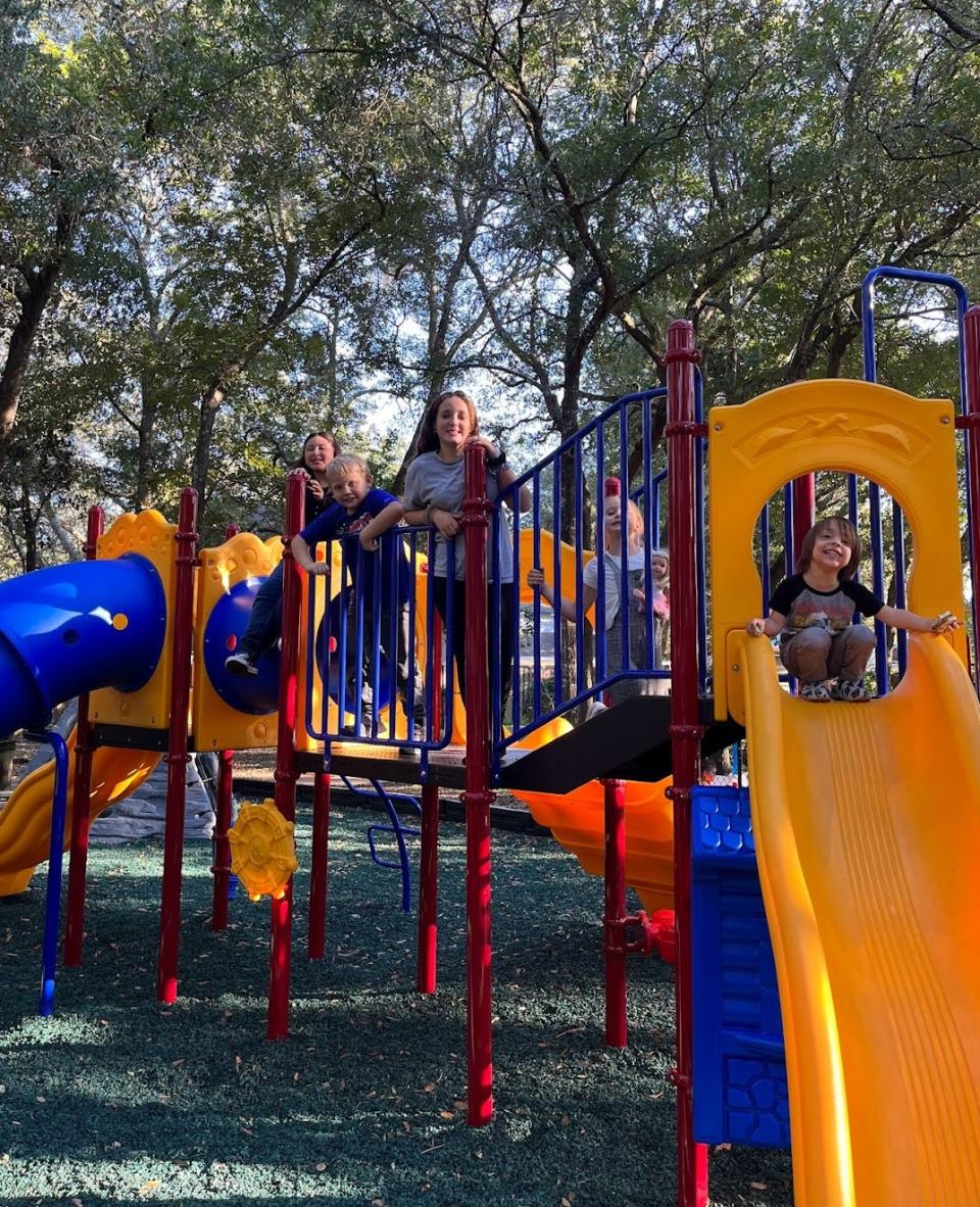 Kids and parents were already enjoying the new playground set. Complete with a climbing wall, four slides and a new swingset.