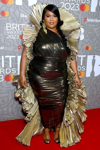 Lizzo poses up a storm in red bodysuit and blouse after reflecting on  her road to success