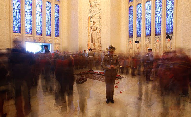 A soldier stands in the Tomb of the Australian Unknown Soldier as the public file past to leave flowers or pay their respects. Credit: AP/file