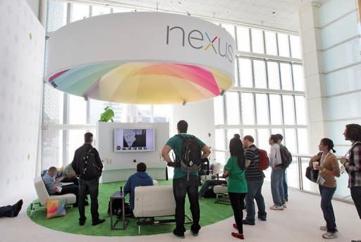 Attendees gather at a display of the Nexus 7 and Nexus Cube at Google's developers conference on June 27. Google said it was releasing a new version of its Android software for mobile devices, called "Jelly Bean," which "builds on top of Ice Cream Sandwich," the current iteration of Android