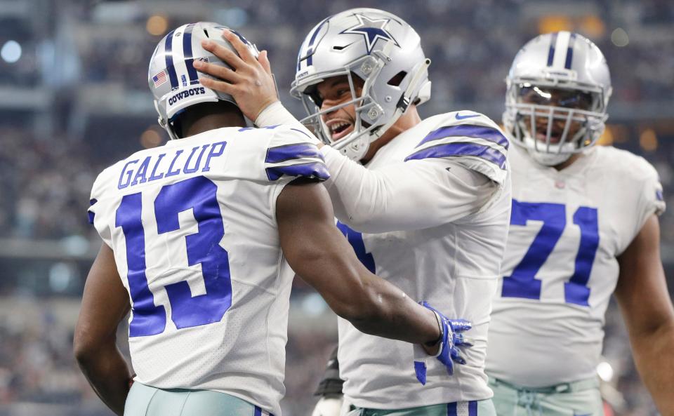 Dallas Cowboys wide receiver Michael Gallup (13) celebrates scoring a touchdown in the third quarter with quarterback Dak Prescott (4) against the Tampa Bay Buccaneers at AT&T Stadium.