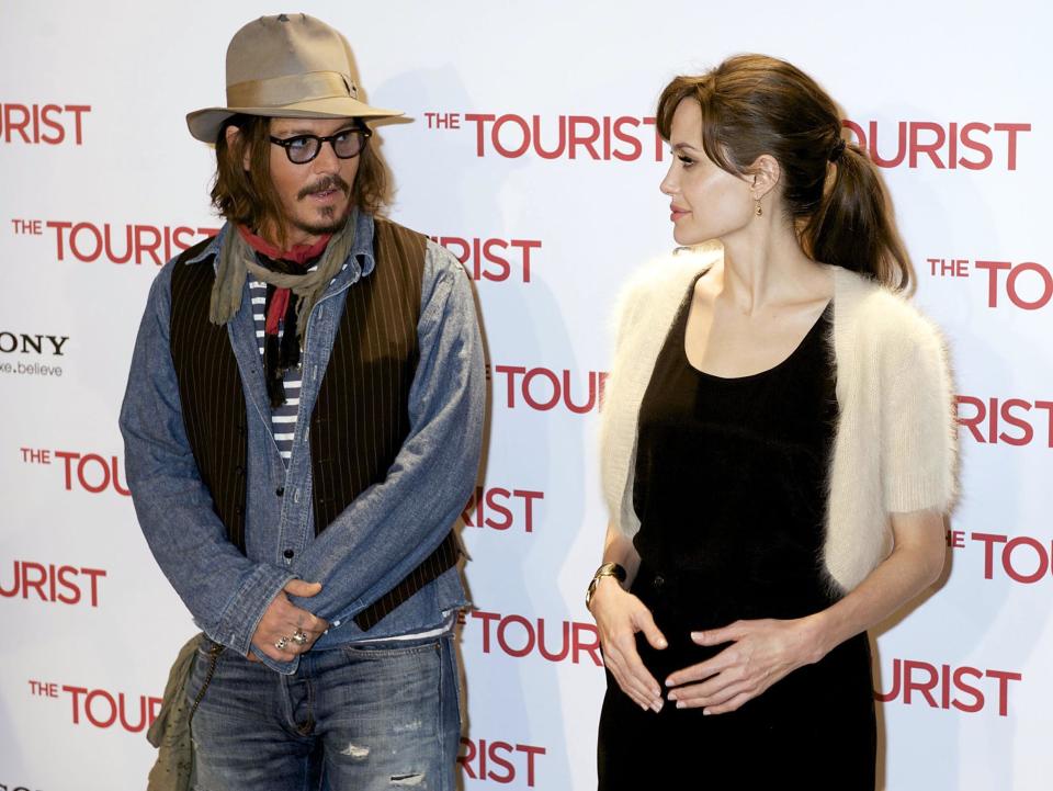 According to new reports, Angelina Jolie has reached out to support Johnny Depp – the pair pictured here at the premiere of their 2010 film The Tourist. Source: Getty