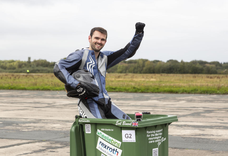 A wacky design engineer is delighted to have set a new Guinness World Record after reaching speeds of over 40mph - in a WHEELIE BIN. Andy Jennings, 28, transformed his green household waste bin into a racing machine - complete with a small motorbike engine, a gear box, ignition, a bike seat, and the steering from a mobility scooter. Andy hit the tarmac in his rigged-out bin to attempt to set his brand new world record. Guinness World Record officials set Andy a benchmark of over 30mph in order to secure the record for fastest wheelie bin. But the engineer, from Swindon, Wilts., smashed his goal - and stormed down the runway at Elvington Airfield in Yorkshire, at a whopping 43mph. Andy's impressive record was just one of several landspeed records broken at Elvington Airfield on Sunday, at an event organised by motorsport racing company Straightliners. Racing down the runway as well as Andy was the world's fastest motorised toilet (44.6mph), and the world's fastest garden shed (at an impressive 106.1mph). But one of the true "stars of the show" was self-confessed 'adrenaline junkie' Jason Liversidge, 44, who reached speeds of almost 65mph in a motorised wheelchair - despite being 95 per cent paralysed.