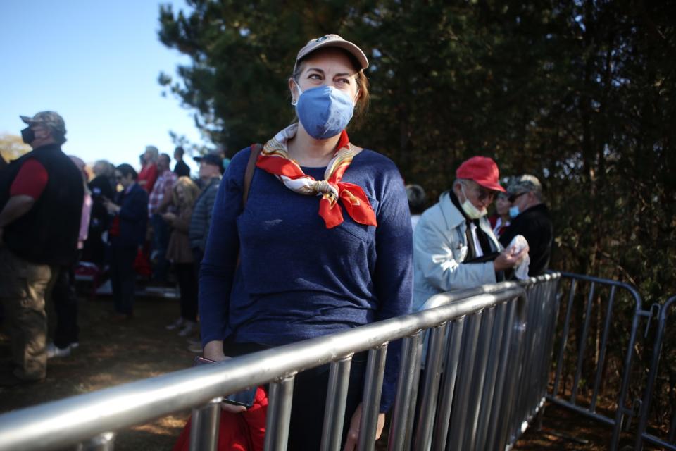 April Lyerly waits for Vice President Mike Pence to speak at a rally.