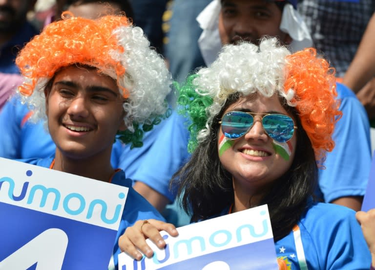 Indian cricket fans cheering during the one day international (ODI) Asia Cup cricket match between Pakistan and India in Dubai