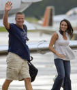 <p>Brett Favre and wife Deanna acknowledge fans as they get off a private jet at Austin Straubel International Airport Sunday, Aug. 3, 2008, in Green Bay, Wis. (AP Photo/Matt Ludtke)</p>