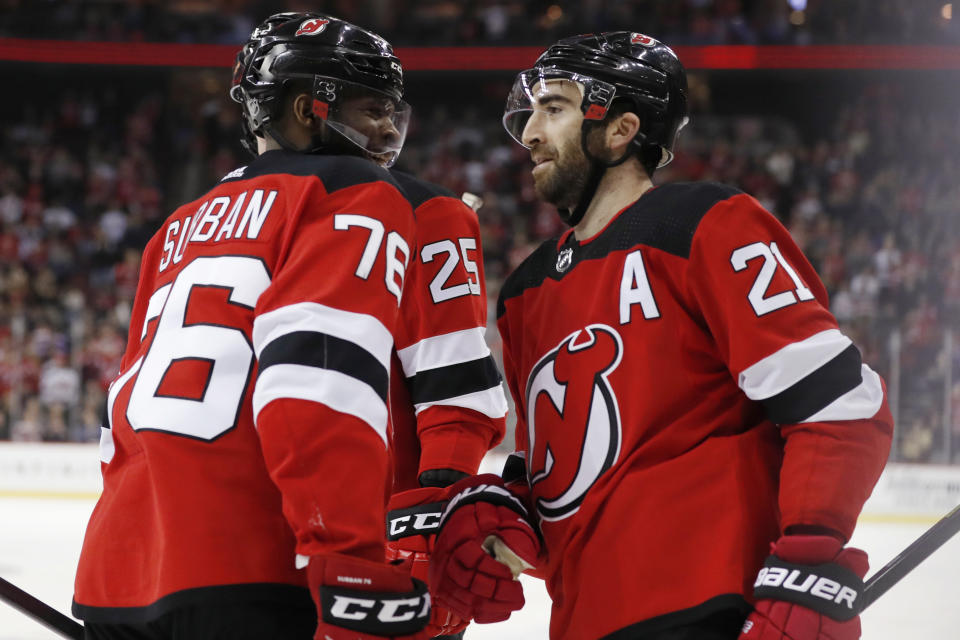 New Jersey Devils defenseman P.K. Subban (76) congratulates right wing Kyle Palmieri (21) after Palmieri scored against the Columbus Blue Jackets during the second period of an NHL hockey game Sunday, Feb. 16, 2020, in Newark, N.J. (AP Photo/Kathy Willens)